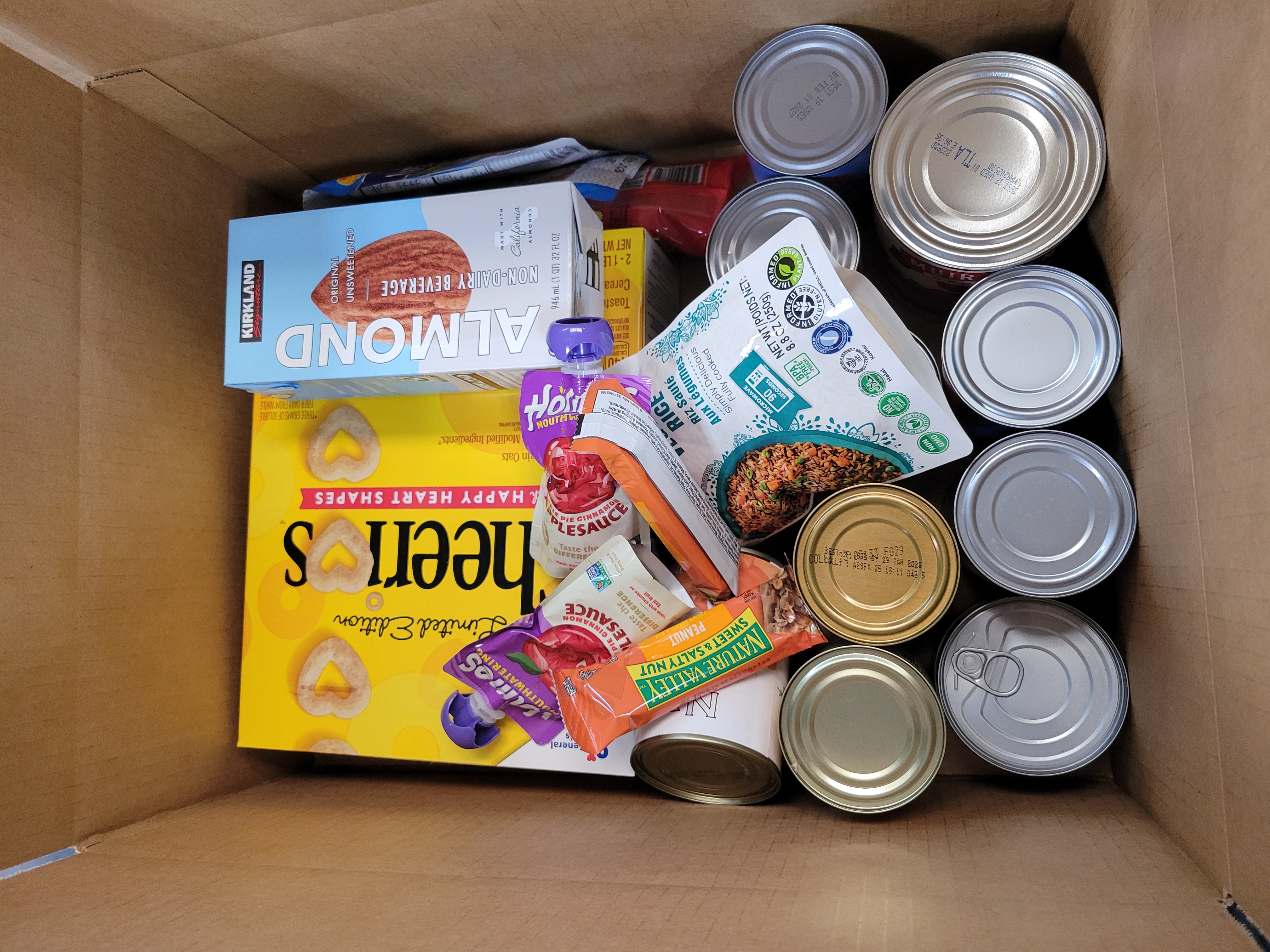 Cardboard box full of dry goods.